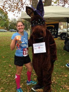 Tracy with Della the Mule proudly showing her medal and one dedicated to Keegan.
