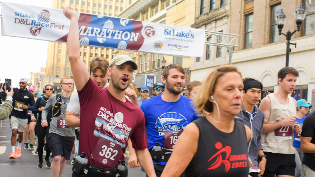 The starting line for the D&L RaceFest marathon in downtown Allentown, with a number of runners crossing the starting line