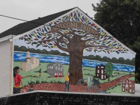The completed mural welcomes visitors and residents alike.