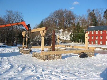 Crews place heavy timbers for Weissport's new pavillion