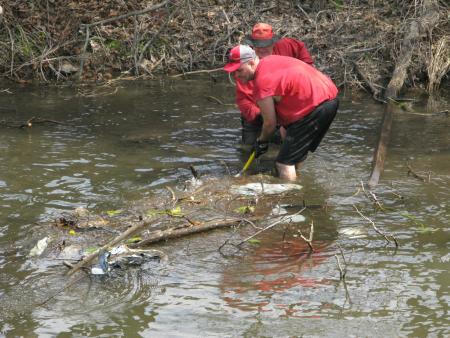 Volunteers remove debris from the canal.
